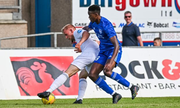 Peterhead defender Jadel Musanhu, right, in action against Cove Rangers in his debut in July.