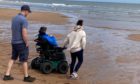 The specialised wheelchair can go over the dunes and down to the sea.