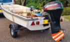 The 13ft vessel, complete with a Mercury outboard motor was tied to a trailer in a layby on the A835 between Tore and Maryburgh Roundabouts.