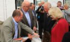 Charles and Camilla came away from Portree with some locally produced organic salmon.