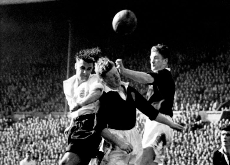 A link between former players and head injuries has been proven. Picture shows England's Stan Pearson and Scotland's Bobby Evans and George Young.