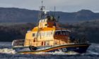 Rescue efforts are ongoing by Oban lifeboat to refloat a stranded yacht south of Oban.