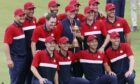 The United States team celebrates with the Ryder Cup.