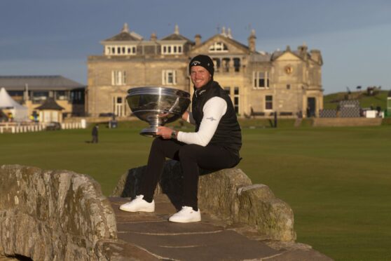Danny Willett on the Swilken Bridge with the Alfred Dunhill Links Championship trophy
