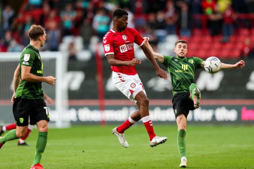 Ryan Christie of Bournemouth is challenged by Tyreeq Bakinson of Bristol City.