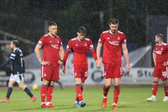 Aberdeen players trudge off at full-time against Dundee.