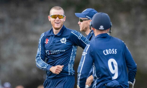 Scotland international cricketer Michael Leask, centre.