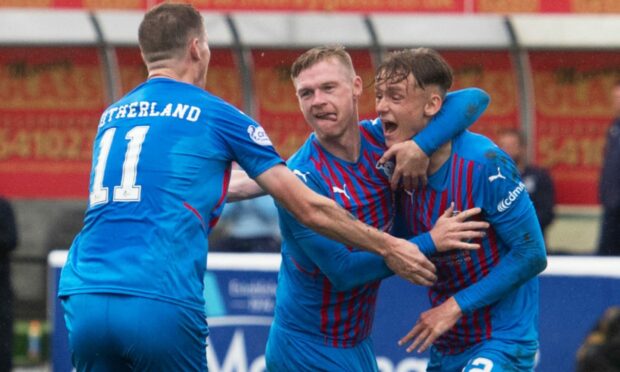 Inverness players congratulate  Billy McKay for their first goal at Elgin.