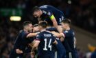Scotland's Scott McTominay celebrates with teammates after scoring to make it 3-2 during a FIFA World Cup Qualifier between Scotland and Israel at Hampden Park. Photo by Craig Foy/SNS Group