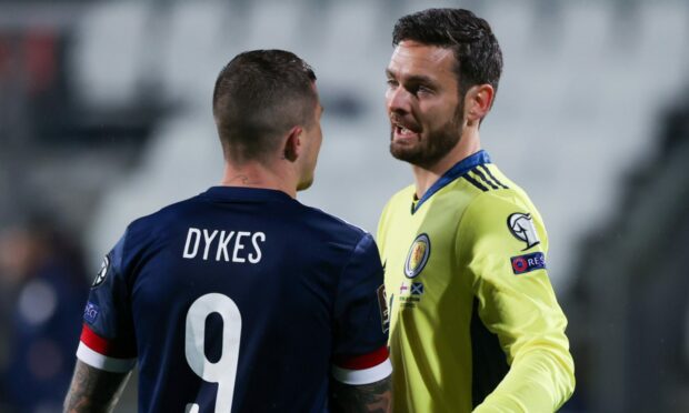 Scotland goalkeeper Craig Gordon with match-winner Lyndon Dykes.