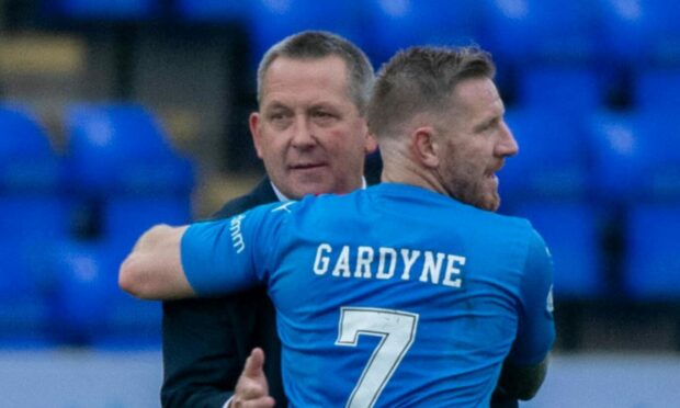 Caley Jags head coach Billy Dodds congratulates second goalscorer Michael Gardyne at full-time.