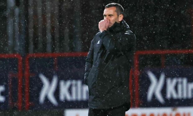 Low point. Manager Stephen Glass at Dens Park as the Dons winless run hits 10 games.