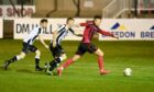 Kieran Shanks, right, looks to get a shot away for Inverurie against Fraserburgh