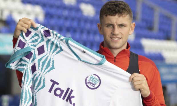 Inverness CT midfielder Reece McAlear with the FC United to Prevent Suicide kit, as part of a national campaign to save lives. You can follow the team on Twitter: @_FCUnited.