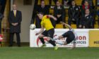 Nairn captain Conor Get hins, left, tries to get away from a Clach defender
