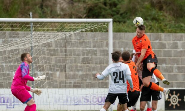 Ryan McRitchie attempts to force the ball into the net for Rothes against Brora Rangers in the North of Scotland Cup final