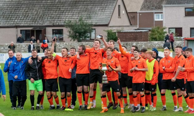 The Rothes squad celebrate winning the North of Scotland Cup final