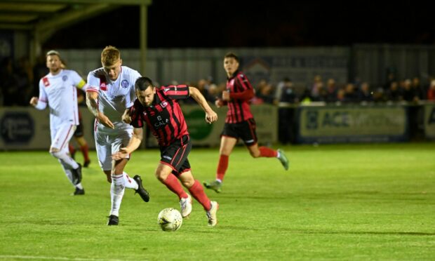 Inverurie's Neil Gauld, right, tries to get away from Brechin's Jamie Bain