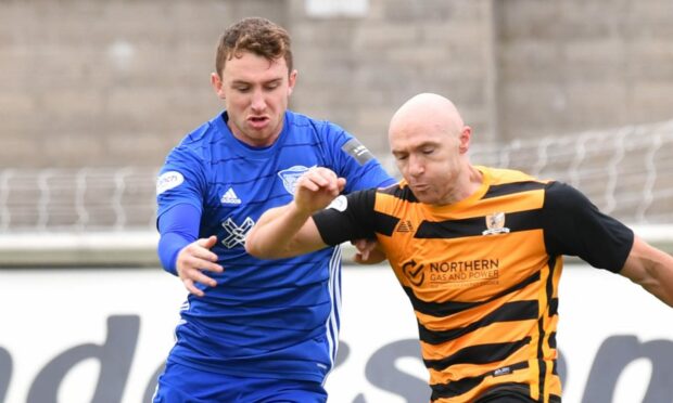 Peterhead defender Andy McDonald, left, in action against Alloa Athletic.