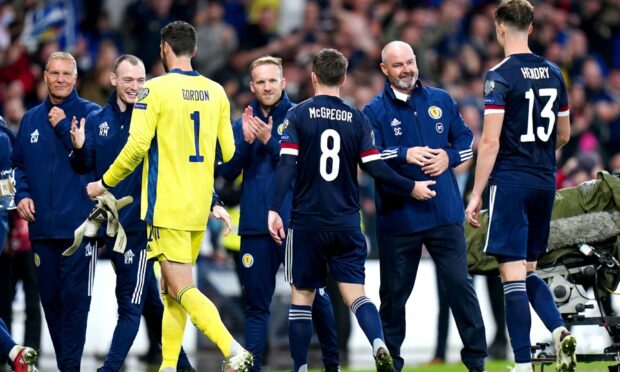 Scotland manager Steve Clarke (second right) speaks to Jack Hendry at the end of the qualifier against Israel.