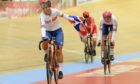 Great Britain's Neah Evans, left, and Katie Archibald, right, celebrate after winning the gold medal in the women's Madison race Final, during the UEC Track Cycling European Championships at the Velodrome Suisse in Grenchen, Switzerland, Saturday, Oct. 9, 2021. (Anthony Anex/Keystone via AP)