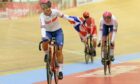 Great Britain's Neah Evans, left, and Katie Archibald, right, celebrate after winning the gold medal in the women's Madison race.