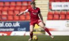 Aberdeen left-back Mackenzie in action in the 1-0 defeat of St Johnstone.
