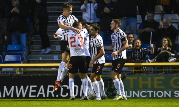 Dunfermline players celebrate the equaliser against Caley Thistle.