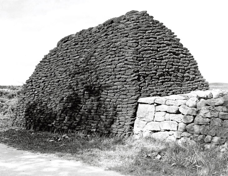 1930s: Peats at the side of the road near Aberdeen.