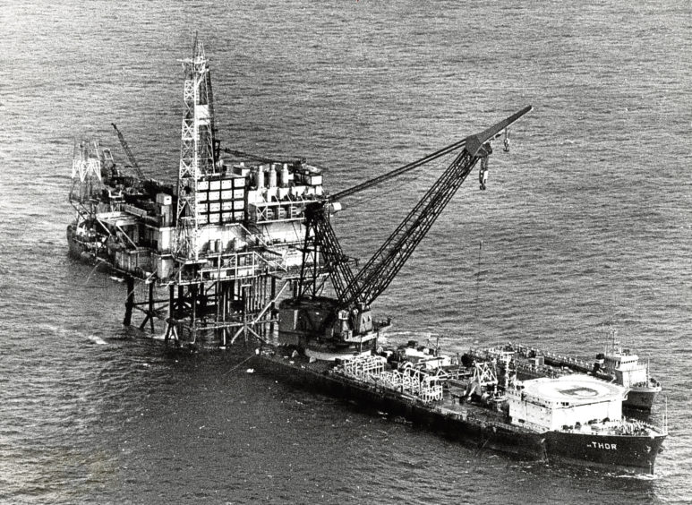 1976: BP Forties’ FC platform with the giant crane barge Thor and a supporting supply vessel.