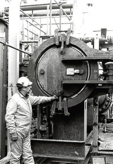1982: Neil Anderson, offshore installation manager, inspects the pipe end.
