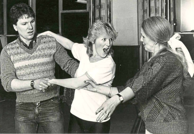 1985: Donald Munro and Rhonda Mair, who play Tommy and Winnie Tait in Annie, get a helping hand during rehearsals.