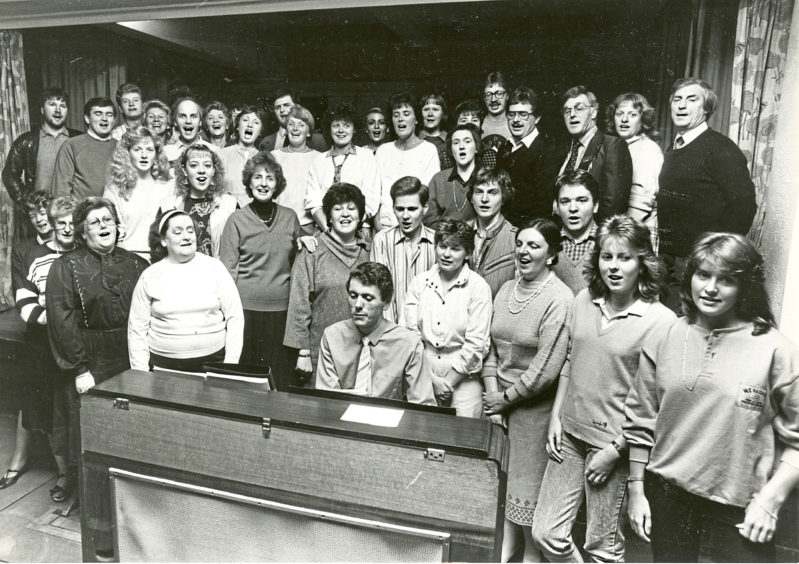 1985: Getting into the swing of things are the members of the Lyric Musical Society who are pictured at their first rehearsal for Hello Dolly to be staged at HM Theatre next March, their 30th show at the theatre. Musical director Ewen Ritchie (at piano) put them through their paces at Beechwood School last night.