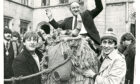 1985 - After his installation as Rector of Aberdeen University, Hamish Watt is carried by his supporters on the charities mascot Angus across to the Kirkgate Bar for the traditional refreshments