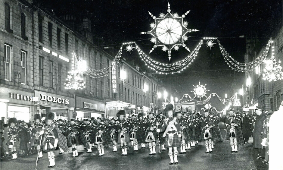 1964: A marching band at the switch-on with new lights bought from London that year.