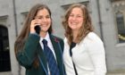 Lily Macdonald celebrates with her mum Emma Davidson after recieving a call to tell her she been accepted into university.