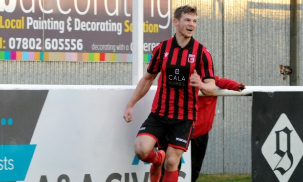 CR0018705
Breedon Highland Football League
Inverurie Locos (red) v Rothes (white) at Harlaw Park, Inverurie.
Picture of Andy Hunter celebrating after scoring to make 4-0.

Picture by KENNY ELRICK     25/01/2020
