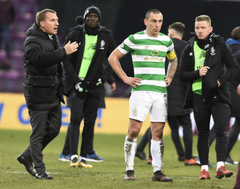 Celtic manager Brendan Rodgers and Scott Brown after the final whistle of the Ladbrokes Scottish Premiership match at Tynecastle.