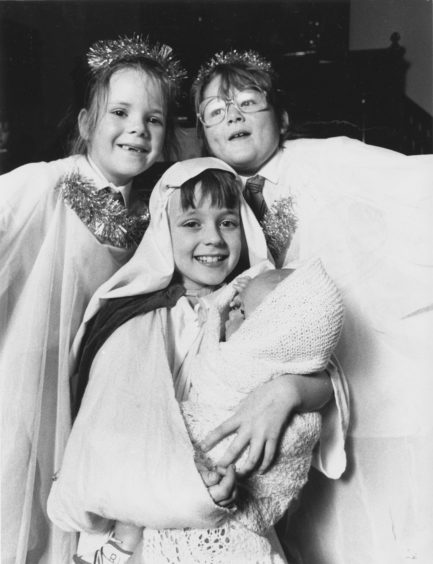 1989: Pamela (centre) looks angelic between angels Carinne Shirran (right) and Jennifer Clyne, both aged seven.