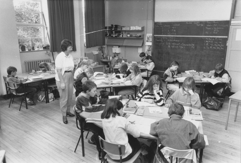 1990: Victoria Road Primary School class 7 teacher, Mrs Smith, watches her young consumers and possible advertising campaigners of the future.