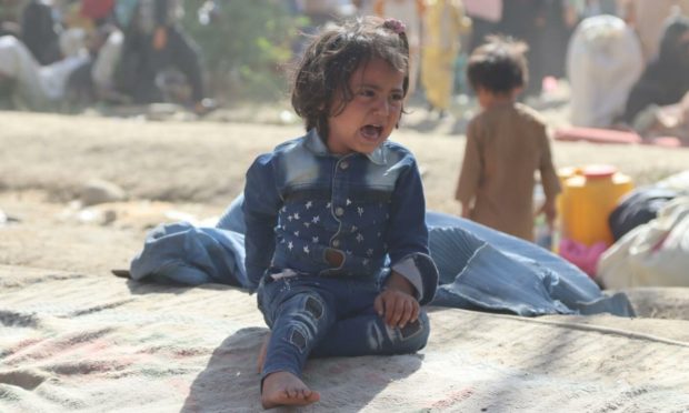 Afghans who are displaced from Kunduz and Takhar provinces due to fighting between Taliban and Afghan forces live in temporary shelters at a camp in Kabul (Photo: JAWED KARGAR/EPA-EFE/Shutterstock)