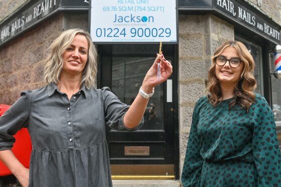 Owner Julie Hulcup with daughter Ellie with the key to the new beauty salon in Aberdeen, The Collective