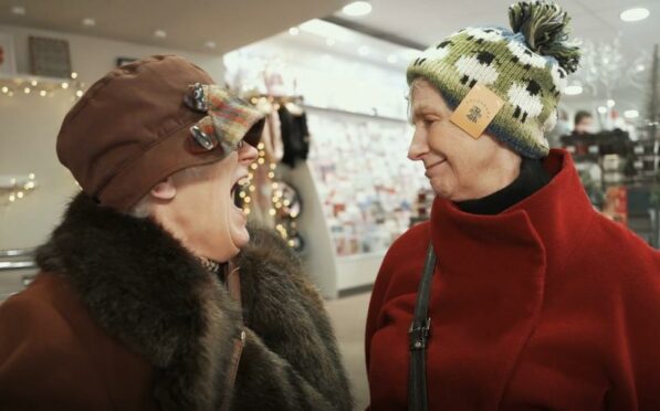 Still from Gift of Aberdeenshire video, two women smiling at each other.