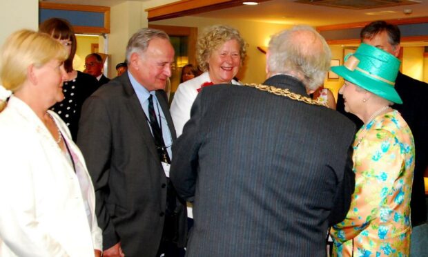 George Goudsmit, managing director of AES Solar, meeting the Queen. Pic supplied by Nigel Young.