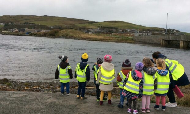 Out and about: School life in Orkney exposes children to the elements, but also the beauty of island life.