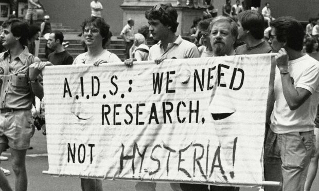A group advocating AIDS research during the 14th annual Lesbian and Gay Pride parade in New York in 1983 (Photo: Mario Suriani/AP/Shutterstock)