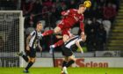 Aberdeen's David Bates rises for a header against St Mirren.