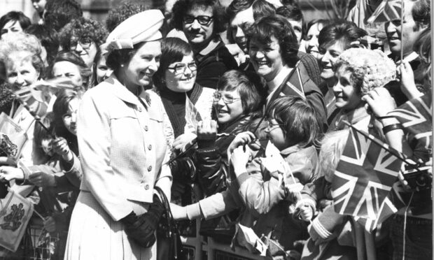 The Queen enjoying the Silver Jubilee celebrations on Aberdeen’s Broad Street in 1977.