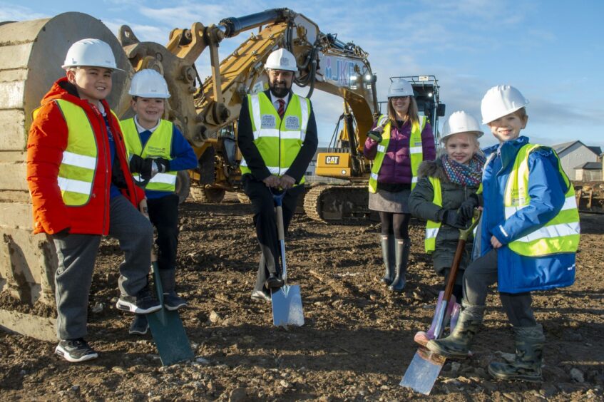 Council education convener M Tauqueer Malik, headteacher Paula Rough and primary four pupils got their hands dirty as construction of the new Countesswells School started in November. Picture by Aberdeen City Council.