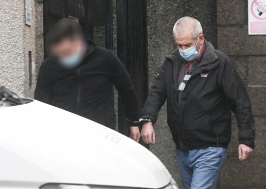 Timothy Humphreys is taken to prison from Aberdeen Sheriff Court.